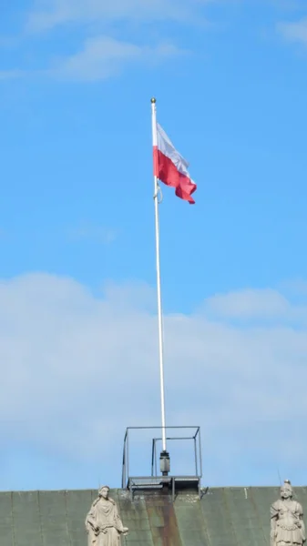 View of a polish flag on the presidential palace in Warsaw