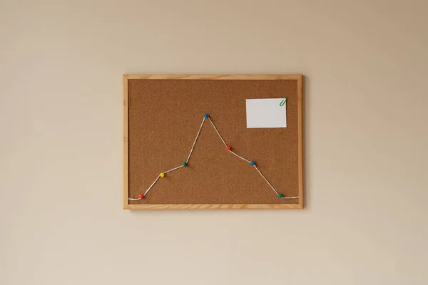 increase graph, summit, peak, top. decrease development market growth financial chart productivity data. concept of progress report. cork board, colorful pins and rope, string, copy space. white paper
