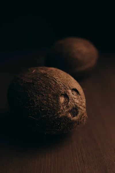 Raw coconut on the wooden oak table. Blurred background — Stock Photo, Image