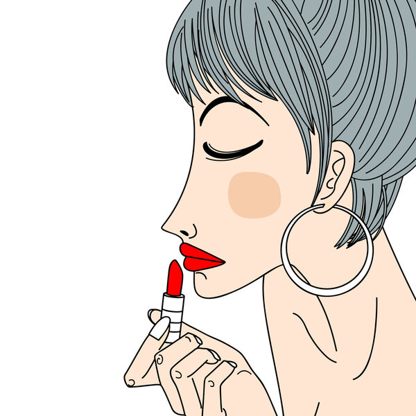 woman applying lipstick