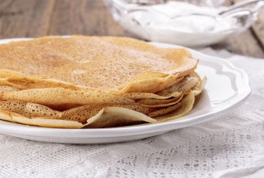 Stack of freshly homemade crepes clipart