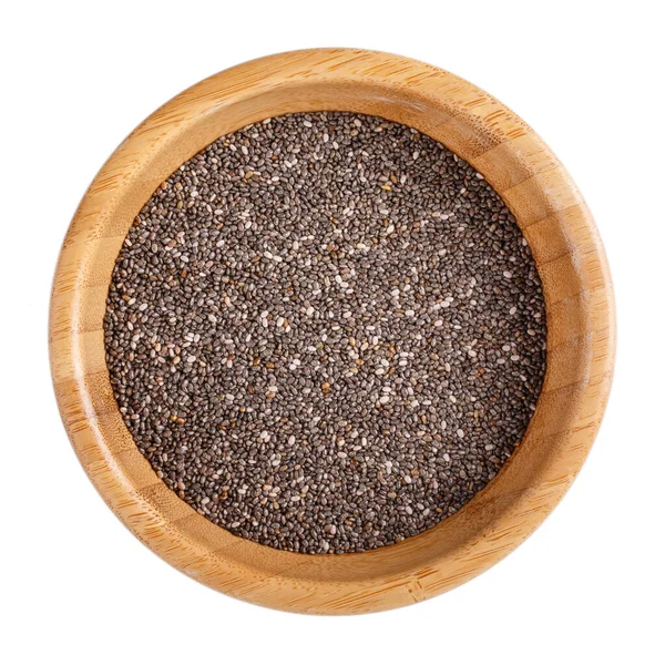 Tahta kasedeki siyah chia tohumları beyaza izole edilmiş. Üst görünüm.