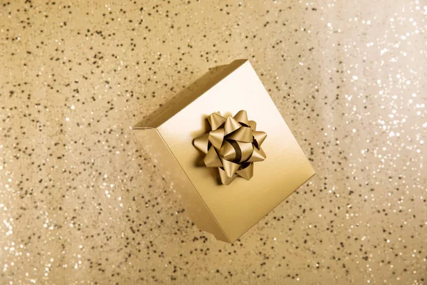 Golden Gift Box Gold Bow Shiny Background Top View Copy — Stockfoto
