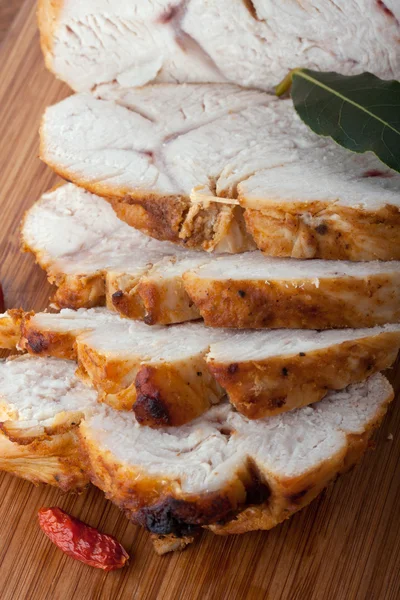 Roasted turkey breast on wooden plank — Stock Photo, Image