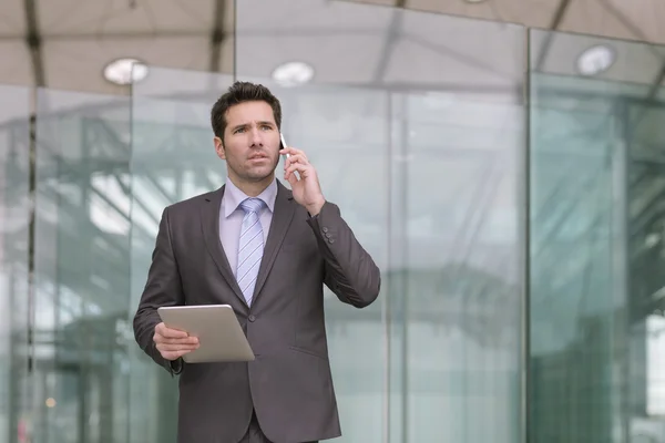 Businessman using a digital tablet — Stock Photo, Image