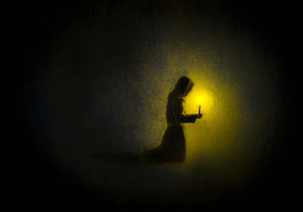 Mönch betet mit einer Kerze — Stockfoto