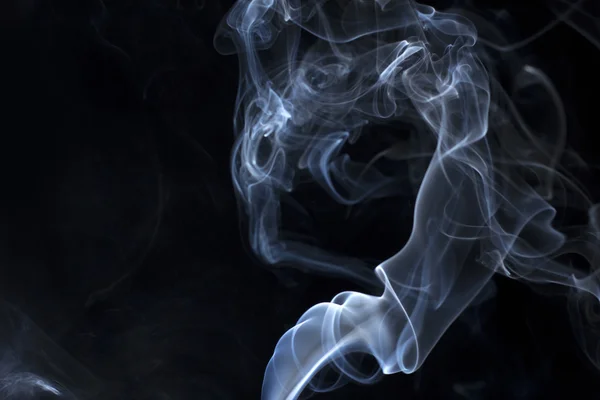 Smoke swirls on a dark background — Stock Photo, Image