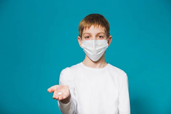 Boy protection mask offering pill — Stock Photo, Image