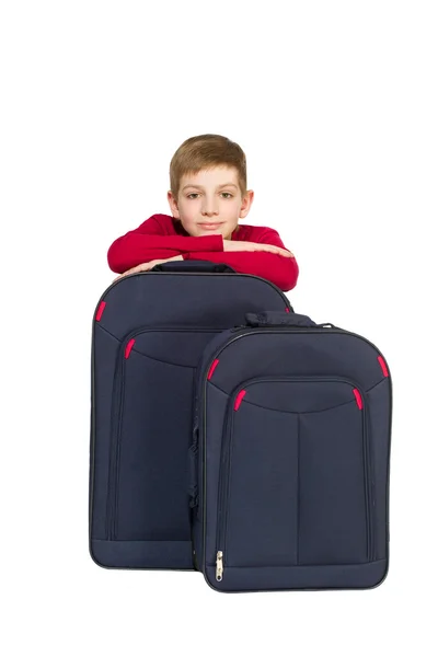 Portrait of boy with travel bags isolated on white — Stock Photo, Image