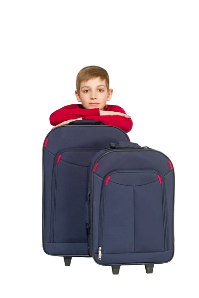 Portrait of smiling boy with travel bags isolated on white — Stock Photo, Image