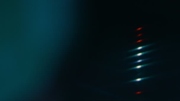 Macro d'un disque vinyle. Flares sur disque vynil changer de couleurs. Image floue. Bokeh ! — Video