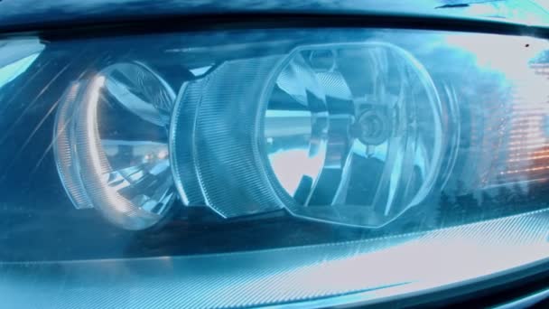 Close-up of headlight flashing smoothly. Car details presentation in slowmotion. — Stock Video