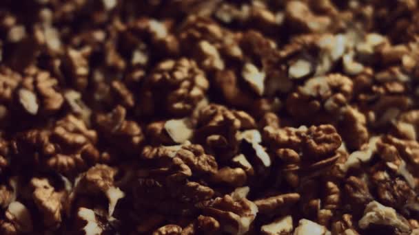 Walnut macro. Product rich in minerals and vitamins. Walnut kernels falling in stack in the process of production. 4K video — Stock Video