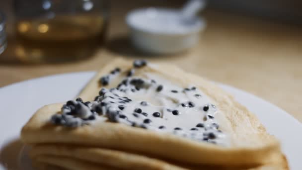 Lump Fish black Roe Blinis with Taramasalata. Isolated closeup macro. 4K video — Stockvideo