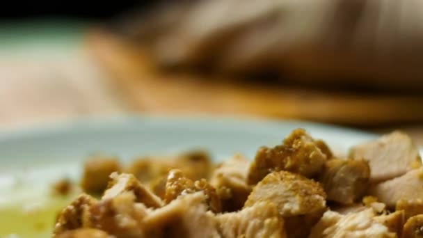 Fried chicken breast spiced with mexican spice mix being chopped on a woodent cutting board. Process of making quesadillas. Macro view — Stock Video