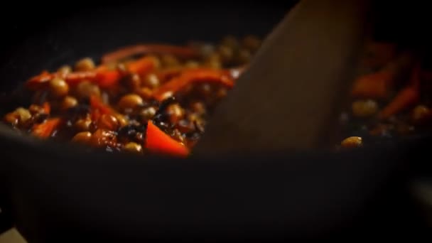 Mix with wooden spoon pilaf. 4k video — Stock Video