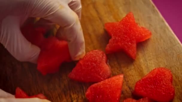 I cut the watermelon pieces in the shape of a heart and stars. 4k video — Stock Video