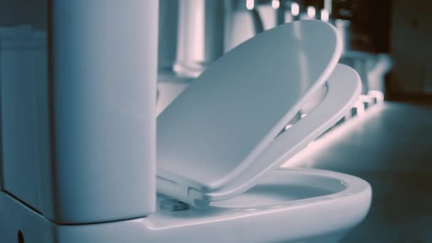 Rotating Toilet bowl. Studio filming. In the background a row of toilets. 4k video — Stock Video