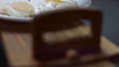 Salting the second heart shaped fried egg.