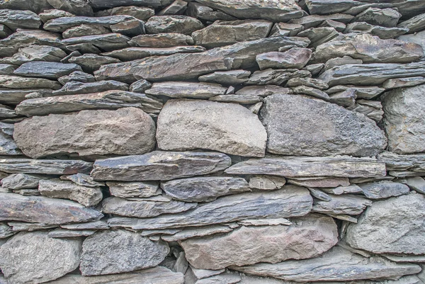 Antecedentes Pared montada a partir de piedras —  Fotos de Stock