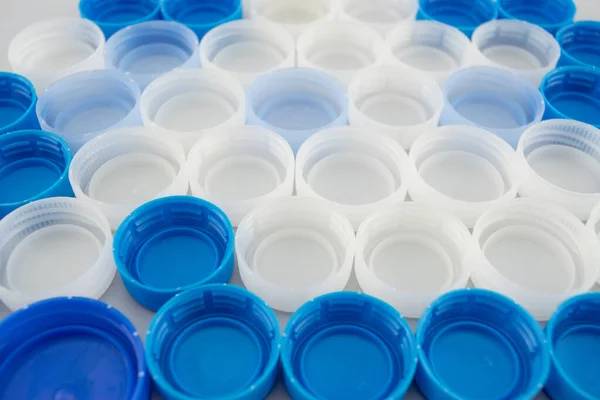 Blue, white and transparent bottle caps