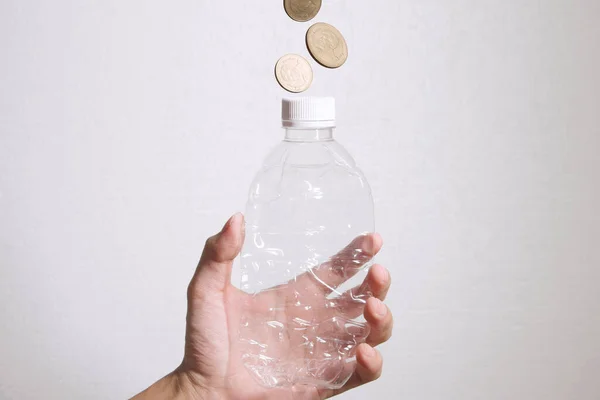 Plastic Bottle make Money. Recycle plastic bottle to money. Concept for recycle and make money with plastic bottle