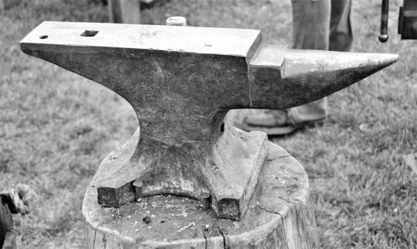 Old Iron Anvil. An anvil is a metalworking tool consisting of a large block of metal (usually forged or cast steel), with a flattened top surface, upon which another object is struck (or \