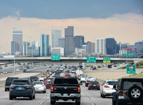 Driving on I-25 towards downtown Denver during rush hour. 