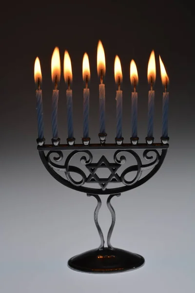Jewish Candle Holder with lit candles are part of Jewish traditional celebrations.
