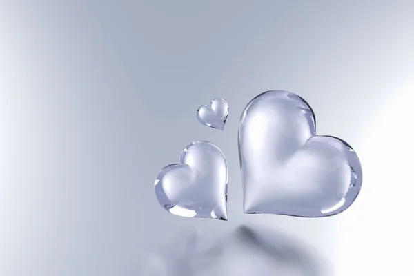 Glass heart isolated on grey colour background — Stock Photo, Image