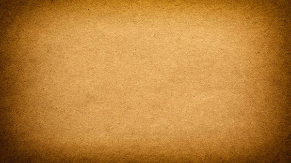 Винтажный фон старой грубой коричневой бумаги с виньеткой — стоковое фото
