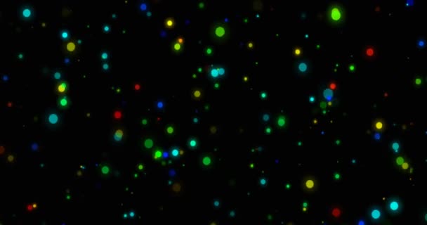 Flickering multicolored bokeh particles on a black background, 4k animation — Vídeo de Stock