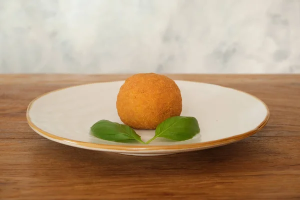 fried arancino rice ball traditional sicilian food, Italy