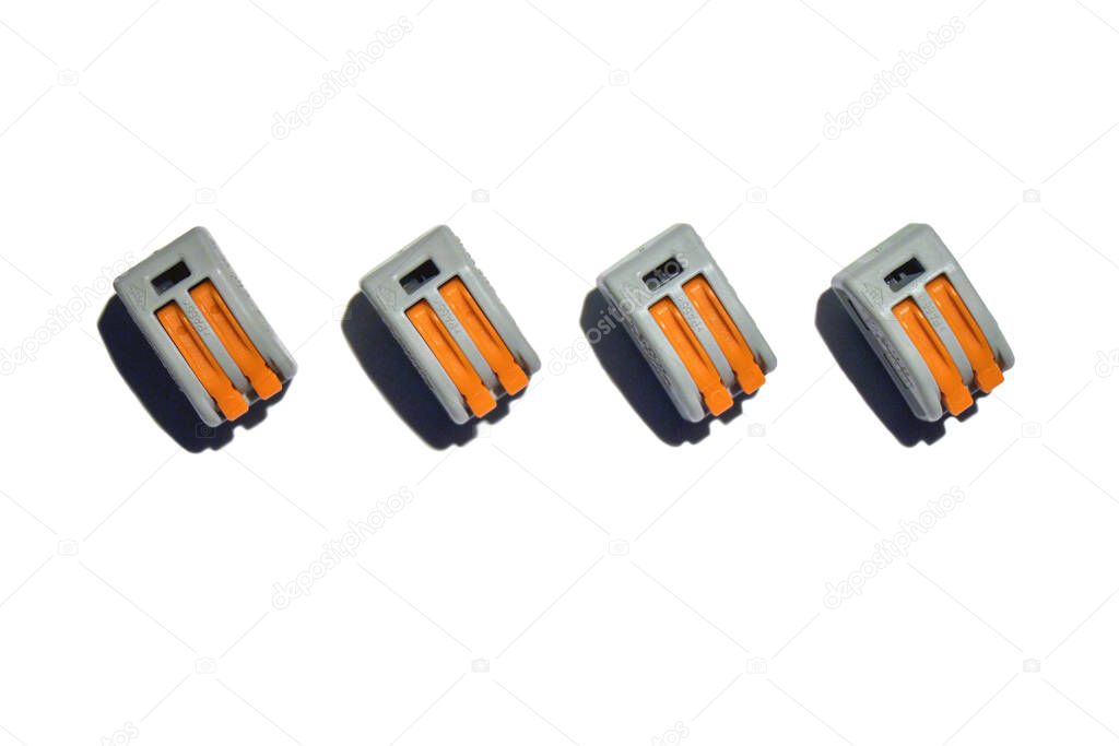 Electrical crimp terminals for connecting electrical wires. Accessories and additional equipment. Close-up on a white background.