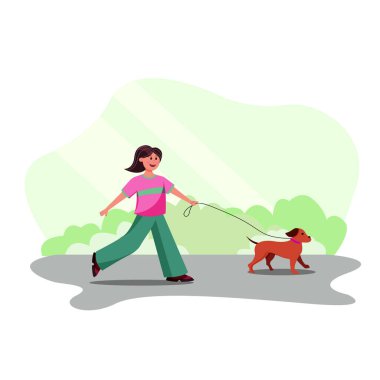 Parkta köpek gezdiren bir kadın.