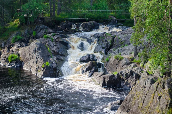 Waterfall. Park of waterfalls on the Tohmajoki river near the Ruskeala village in Karelia. North of Russia. Traveling in the Russian Federation.