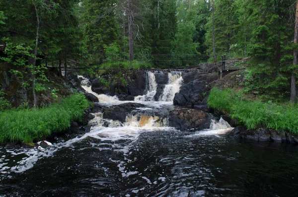 Waterfall. Park of waterfalls on the Tohmajoki river near the Ruskeala village in Karelia. North of Russia. Traveling in the Russian Federation.