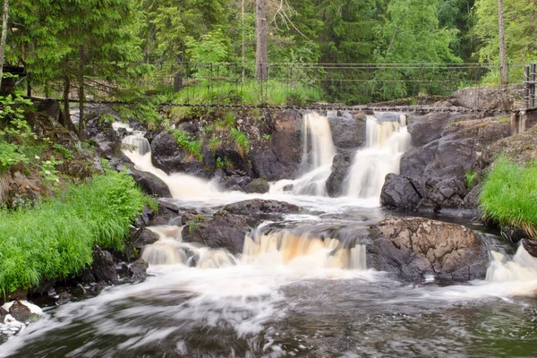 Waterfall. Park of waterfalls on the Tohmajoki river near the Ruskeala village in Karelia. North of Russia. Traveling in the Russian Federation.