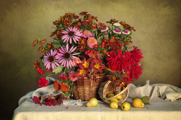 A large bouquet of flowers with fruit