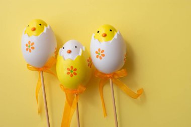 Easter eggs on colorful yellow background family illustration