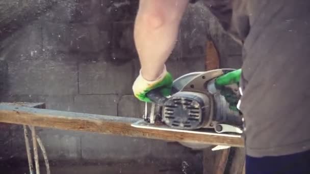 Close-up of carpenter cutting a wooden plank — Stock Video