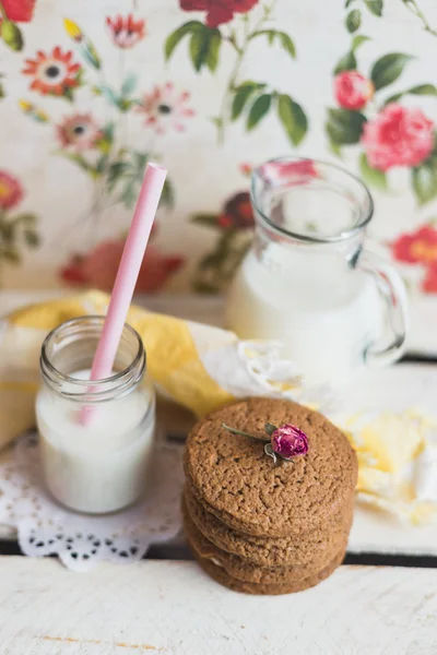 Rustic home made cookies on the wooden background with milk — Stock Photo, Image