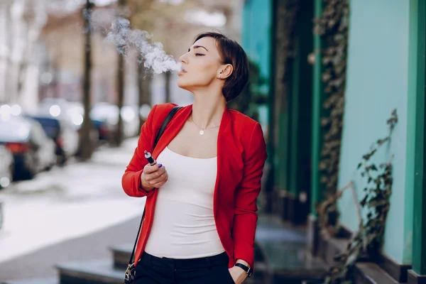 Girl with the electronic cigarette — Stock Photo, Image