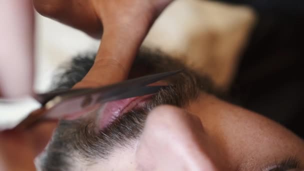 Barber cut a clients mustache with clippers — Stock Video