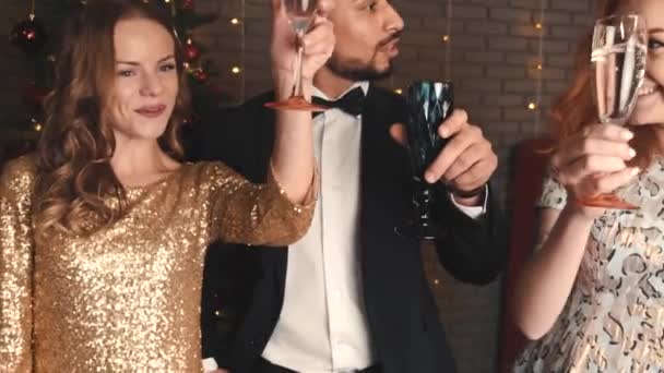 Mixed race friends clinking at holiday party in new year — Stock Video
