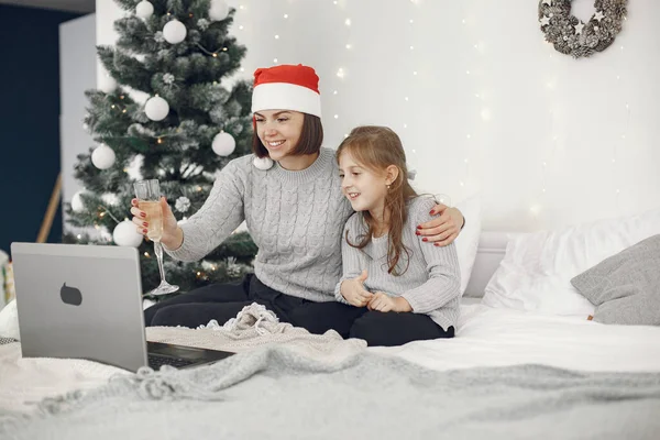 People having fun with their friends video chat at home for Christmas