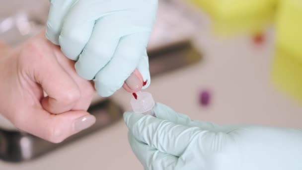 A healthcare worker doing finger-stick whole blood antibody test — Stock Video