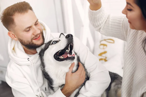 Beautiful couple spend time in a bedroom — Stock Photo, Image