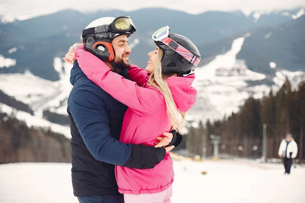 Winter snow couple in a mountains