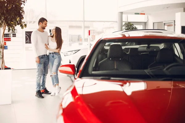 Stylish and elegant family in a car salon — Fotografia de Stock